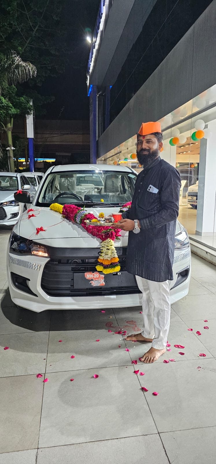 Team celebrating a new car delivery - Pragati Tours and Travels